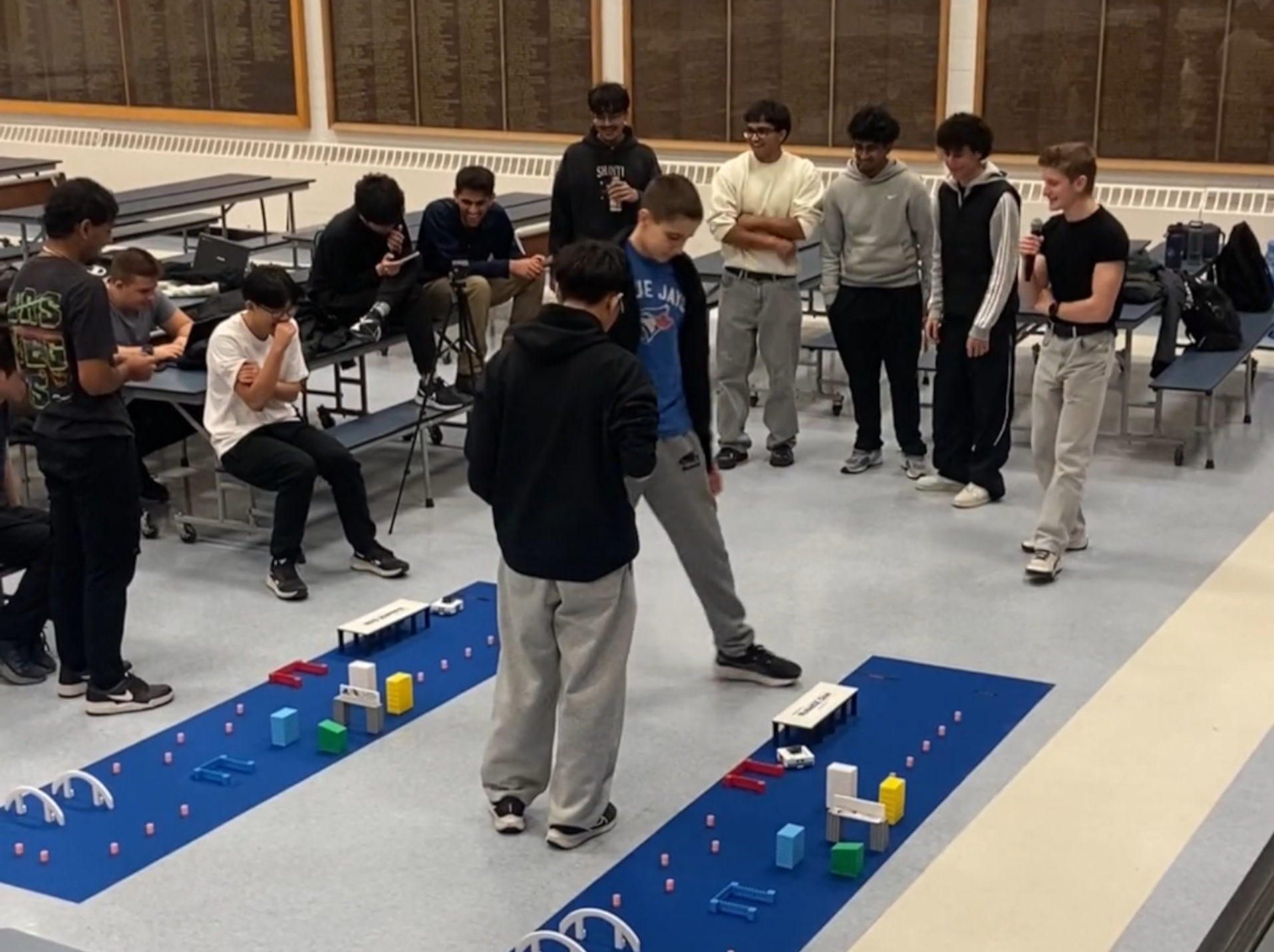 Students racing robots on the two tracks