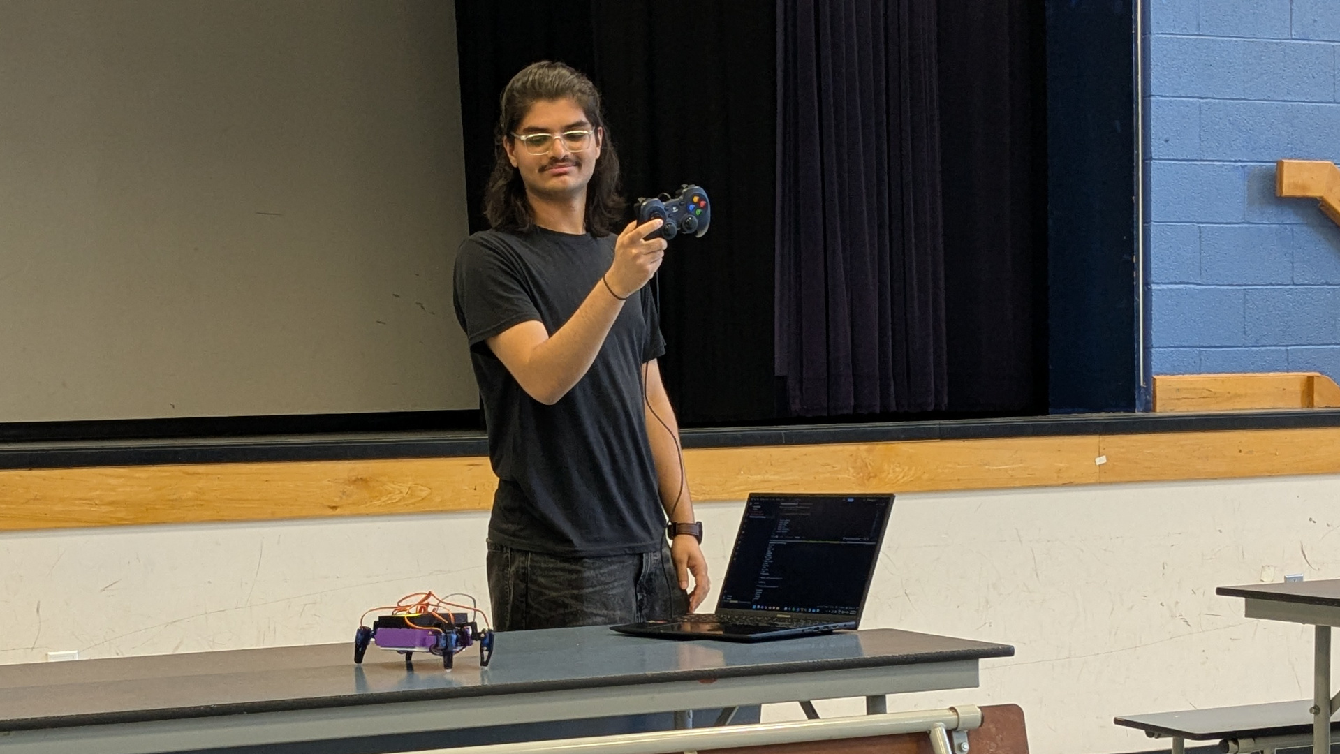 A participant demonstrating a Stackr add-on with a game controller